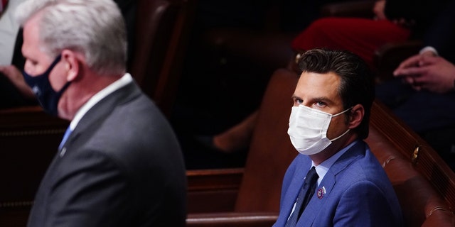 Republican Representative-elect Matt Gaetz of Florida, right, listens as House Minority leader Kevin McCarthy of California speaks during the restart of a House session of Congress in Washington, D.C., Jan. 6, 2021.