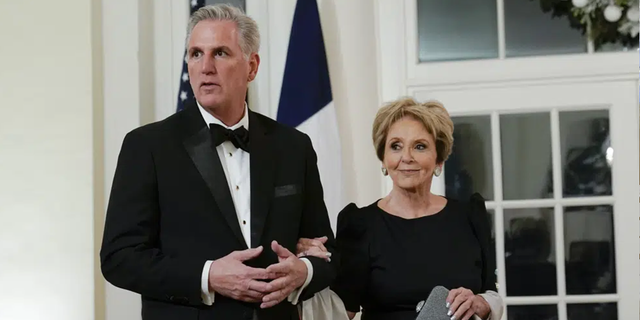 House Minority Leader Kevin McCarthy and his mother, Roberta McCarthy, arrive for the State Dinner with President Biden and French President Emmanuel Macron at the White House in Washington, Thursday, Dec. 1, 2022