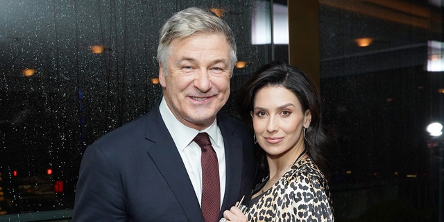Alec Baldwin gets support from wife Hilaria in new photos as she wears 'boundaries' top amid his criminal charges.