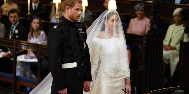 Prince Harry and Meghan Markle stand together for their wedding in St George's Chapel, Windsor Castle, in Windsor, England, on May 19, 2018.