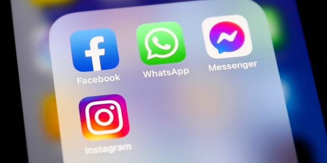 Facebook, WhatsApp, Messenger and Instagram icons displayed on a phone screen are seen in this illustration photo taken in Krakow, Poland, April 6, 2022. 