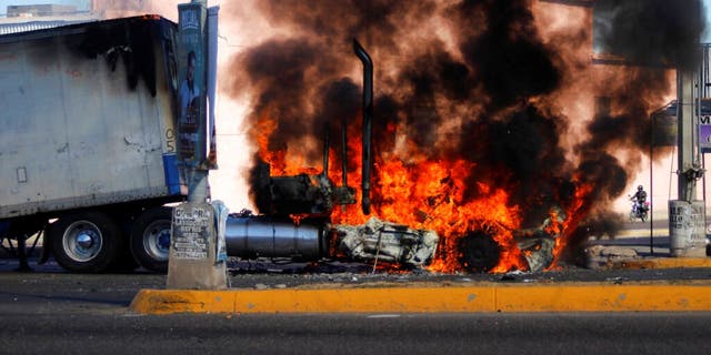 A truck burns on a street in Culiacan, Sinaloa state, Thursday Jan. 5, 2023. Mexican security forces captured Ovidio Guzmán, an alleged drug trafficker wanted by the United States and one of the sons of former Sinaloa cartel boss Joaquín "El Chapo" Guzmán, in a pre-dawn operation Thursday that set off gunfights and roadblocks across the western state’s capital. 