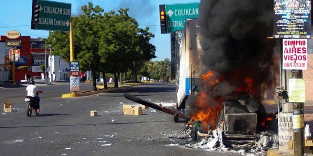 A truck burns after being set on fire on a street in Culiacan, Sinaloa state, Thursday, Jan. 5, 2023. Mexican security forces captured Ovidio Guzmán, an alleged drug trafficker wanted by the United States and one of the sons of former Sinaloa cartel boss Joaquín "El Chapo" Guzmán, in a pre-dawn operation Thursday that set off gunfights and roadblocks across the western state’s capital. 