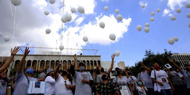 Relatives of disappeared people gather for a tribute, during the commemoration of the International Day of the Disappeared, in Guadalajara, Jalisco state, Mexico, on Aug. 30, 2020. 