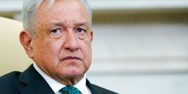 Mexican President Andrés Manuel López Obrador listens as he meets with President Biden in the Oval Office of the White House in Washington, Tuesday, July 12, 2022. 
