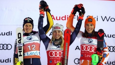 Mikaela Shiffrin celebrates on the podium.