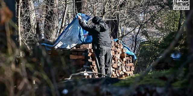 Massachusetts State Police troopers and other officials searched the property, backyard, pool and surrounding area of missing woman Ana Walshe's home in Cohasset Saturday, Jan. 7, 2023.