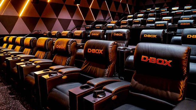 Rows of D-Box seats in an auditorium