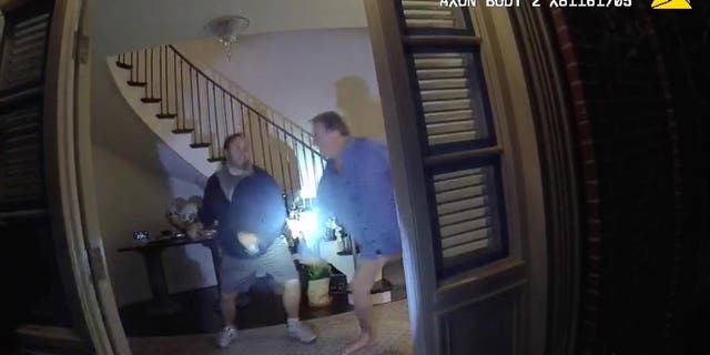 Bodycam footage shows police knocking on the door of Pelosi's home before the door opens to reveal Pelosi and DePape.