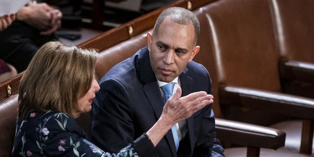 Representative Nancy Pelosi, a Democrat from California, left, speaks with Representative Hakeem Jeffries, a Democrat from New York, during a meeting of the 118th Congress in the House Chamber at the US Capitol in Washington, DC, US, on Friday, Jan. 6, 2023. (Al Drago/Bloomberg via Getty Images)
