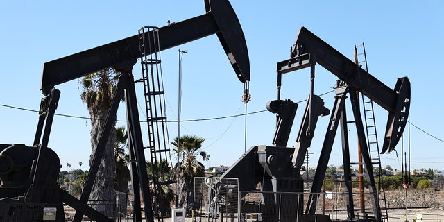 Oil pumpjacks stand in the Inglewood Oil Field in Los Angeles.