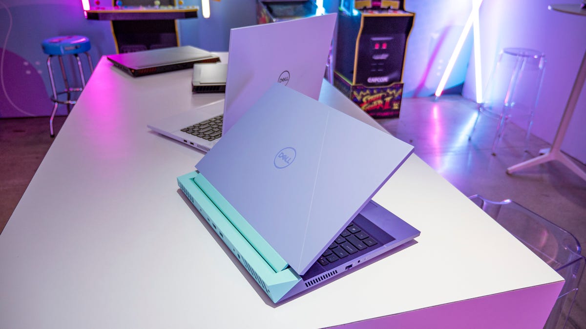 Dell G15 and G16 Gaming Laptops open and on a white table.