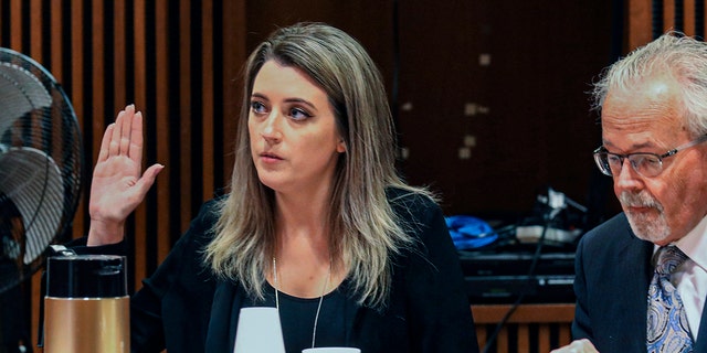 Kate McClure, 32, charged with theft by deception in the $400,00 GoFundMe scam, with her lawyer Jim Gerrow Jr., in State Superior Court, Burlington County Courthouse, Mt. Holly, N.J., April 15, 2019. A New Jersey judge sentenced McClure to a term of one year and one day in prison, for her role in the scam using a fake story about Johnny Bobbitt who was a homeless veteran. 