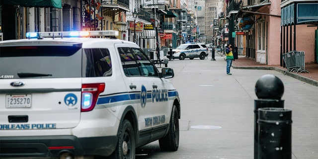 Police vehicles block access to Bourbon Street in New Orleans Tuesday, Feb. 16, 2021. The city has seen an increase in murders in 2022.