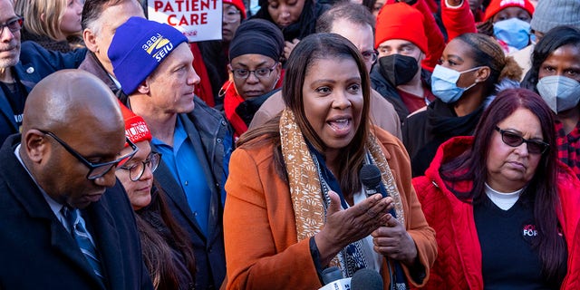 New York Attorney General Letitia James, center, speaks as she is joined by health care professionals and officials during a news conference as nurses stage a strike in front of Mt. Sinai Hospital in the Manhattan borough of New York, Monday, Jan. 9, 2023, after negotiations broke down hours earlier. 