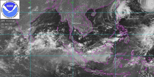 This satellite image released by NOAA 21 October shows smoke from massive forest fires over the Indonesian islands of Borneo and Sumatra. 