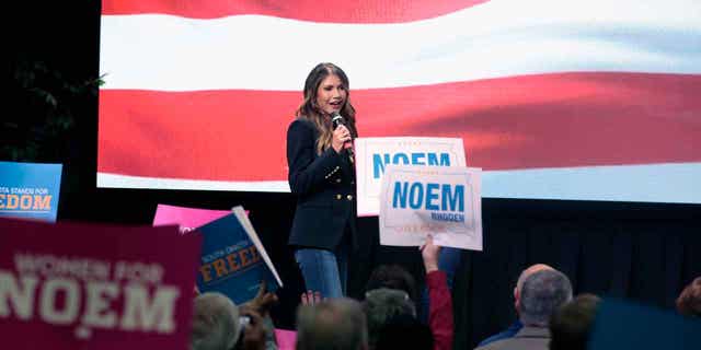 South Dakota Gov. Kristi Noem takes the stage at a campaign rally Wednesday, Nov. 2, 2022 in Sioux Falls, S.D. The Republican governor was easily re-elected days later. (AP Photo/Stephen Groves)