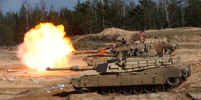 FILE: U.S. Army M1A1 Abrams tank fires during NATO enhanced Forward Presence battle group military exercise Crystal Arrow 2021 in Adazi, Latvia.