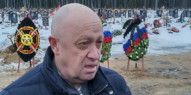 Wagner Group head Yevgeniy Prigozhin attends the funeral of Dmitry Menshikov, a fighter of the Wagner Group who died during a special operation in Ukraine, at the Beloostrovskoye cemetery outside St. Petersburg, Russia, Saturday, Dec. 24, 2022. (AP Photo)