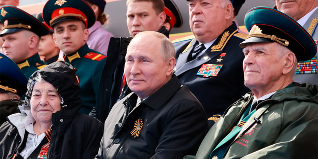 Russian President Vladimir Putin, center, attends the Victory Day military parade marking the 77th anniversary of the end of World War II in Moscow, Russia, Monday, May 9, 2022. (Mikhail Metzel, Sputnik, Kremlin Pool Photo via AP) (Mikhail Metzel, Sputnik, Kremlin Pool Photo via AP) 