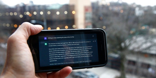 A ChatGPT prompt is shown on a device near a public school in Brooklyn, New York, Thursday, Jan. 5, 2023.