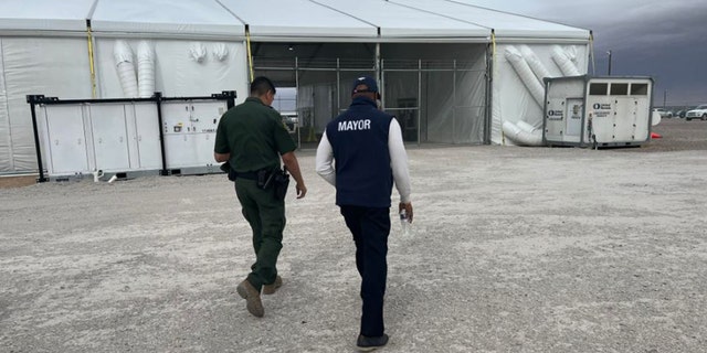 NYC Mayor Eric Adams visits a CBP processing facility. 