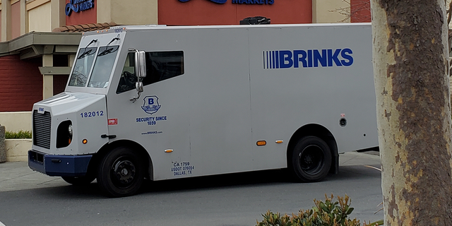 Profile shot of a Brink's armored truck parked in front of Lunardi's Markets, at Palos Verdes Mall in Walnut Creek, California, March 15, 2021.