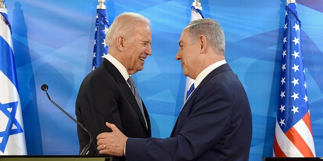 Then-U.S. Vice President Joe Biden (L) shakes hands with Israeli Prime Minister Benjamin Netanyahu as they deliver joint statements during their meeting in Jerusalem March 9, 2016. 