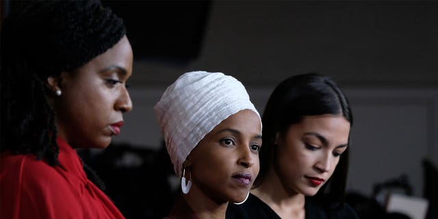 (L-R) U.S. Reps. Ayanna Pressley (D-MA), Ilhan Omar (D-MN) and Alexandria Ocasio-Cortez (D-NY) listen during a news conference at the U.S. Capitol on July 15, 2019 in Washington, D.C.