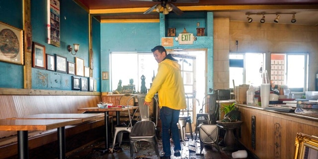 Dominic King, owner of My Thai Beach, surveys storm damage that destroyed his restaurant in Capitola, Calif., on Jan. 5, 2023.