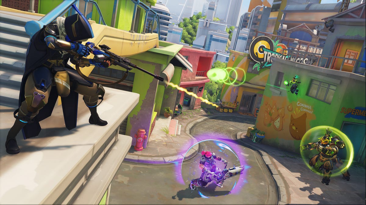 Heroes Ana, Zarya and Orisa battling on Paraiso