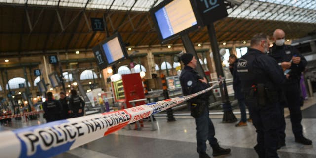 French police cordon off an area at Paris' Gare du Nord train station, after a knife-wielding suspect injured six people, including a police officer, at the Gare du Nord train station in Paris on Jan. 11, 2023. 