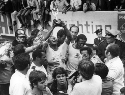 Pelé raises the Jules Rimet Trophy after winning the 1970 World Cup. Brazil was able to permanently keep that trophy for winning its third title, and a new World Cup trophy was introduced in 1974.