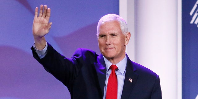Former Vice President Mike Pence waves during the Republican Jewish Coalition Annual Leadership Meeting in Las Vegas, Nevada, on Nov. 18, 2022.