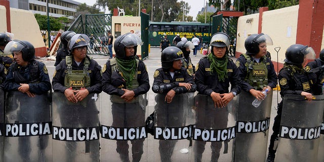 Police guard the San Marcos University in Lima, Peru, Saturday, Jan. 21, 2023. 