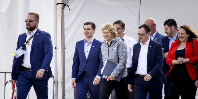 The Buttigiegs are pictured on the Yellow Carpet before the start of the Invictus Games on April 16 in the Netherlands.