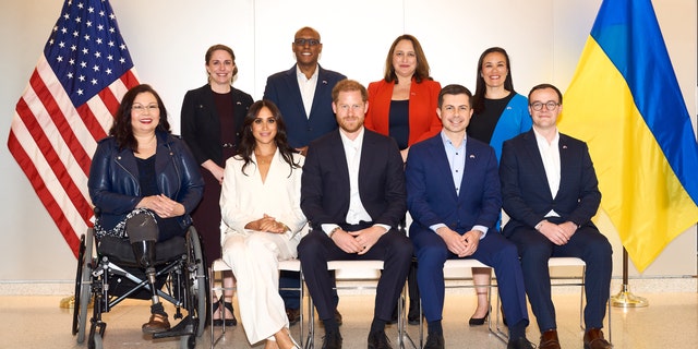 Secretary of Transportation Pete Buttigieg and husband Chasten Buttigieg attend a welcome event with Prince Harry, Meghan Markle and other U.S. officials at the U.S. Embassy ahead of the Invictus Games on April 15 in The Hague, Netherlands. 