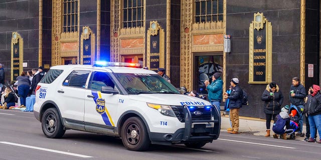 A Philadelphia Police Department marked vehicle with its emergency light activated. The department will disperse more officers into troubled neighborhoods to address violent crime. 