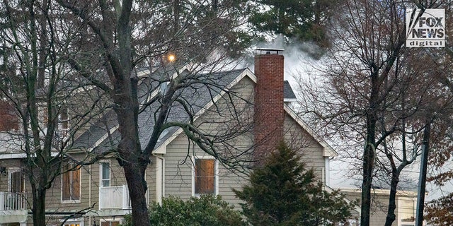 Firefighters battle a blaze at 725 Jerusalem Road in Cohasset, Massachusetts, on Friday, Jan. 7, 2023. The home once belonged to Ana Walshe who has been reported missing, last seen on New Year's Day.