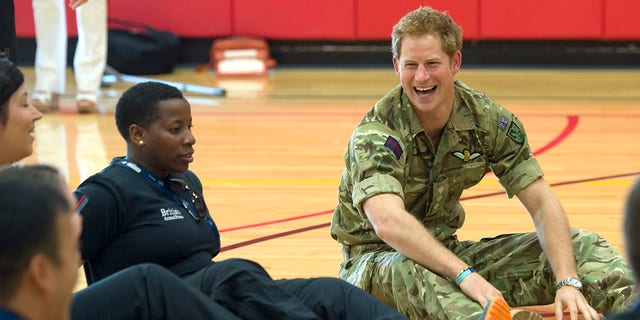 Prince Harry meets injured British soldiers as he attends the Warrior Games during the third day of his visit to the United States on May 11, 2013, in Colorado Springs, Colorado.