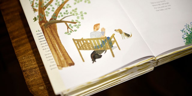 A detail from the children's book "The Bench" by Meghan, Duchess of Sussex, which is inspired by her husband Harry and her son Archie, is pictured on display in a bookshop in London on June 8, 2021, following its release. The Duke of Sussex was seen supporting his wife as she read her book to children during a visit to a New York City school in Harlem.