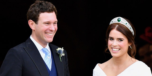 Jack Brooksbank and Princess Eugenie leave St. George's Chapel after their wedding ceremony on Oct. 12, 2018, in Windsor, England.