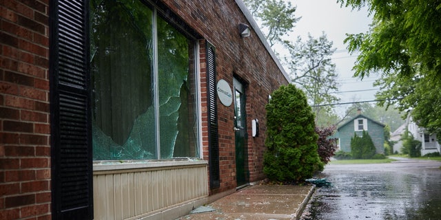 The front windows of the CompassCare office in Buffalo, New York, were smashed out last June.