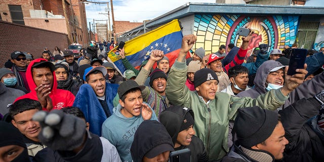 Migrants, mostly from Venezuela, chant slogans as an activists' march in their support arrives to downtown El Paso, Texas, Saturday, Jan. 7, 2023. Several hundred marched through the streets of El Paso a day before President Joe Biden's first, politically-thorny visit to the southern border. 