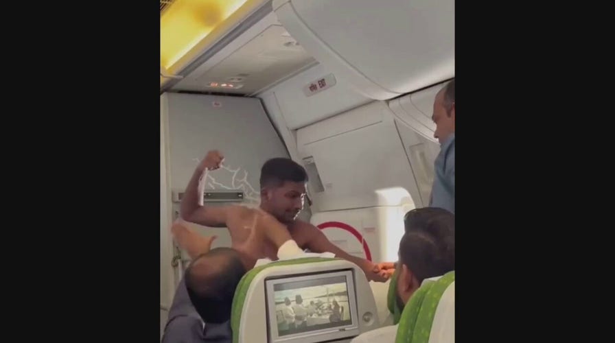 Watch: Shirtless man goes viral after brawl with another man aboard plane