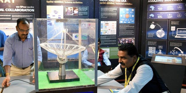 An exhibitor arranges a scaled-down model of Giant Metrewave Radio Telescope (GMRT) Antenna on display during ‘Vigyan Samagam,’ a multi-venue mega-science exhibition, at the Visveswaraya Industrial and Technological Museum in Bangalore on July 29, 2019.
