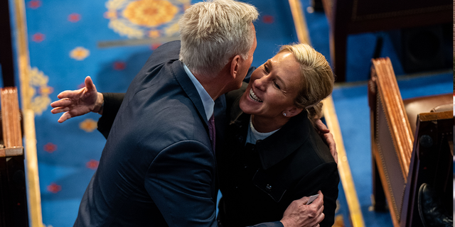 Rep. Kevin McCarthy (R-CA) hugs Rep. Marjorie Taylor Greene (R-GA) on the floor of the House Chamber of the U.S. Capitol Building on Friday, Jan. 6, 2023 in Washington, DC.