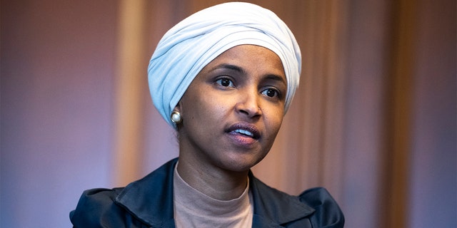 Rep. Ilhan Omar, D-Minn., is seen in the U.S. Capitols Rayburn Room during a group photo with the Congressional Black Caucus