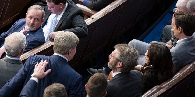 Representative Richard Hudson, a Republican from North Carolina, bottom left, pulls Representative Mike Rogers, a Republican from Alabama, left, as he approaches Representative Matt Gaetz, a Republican from Florida.
