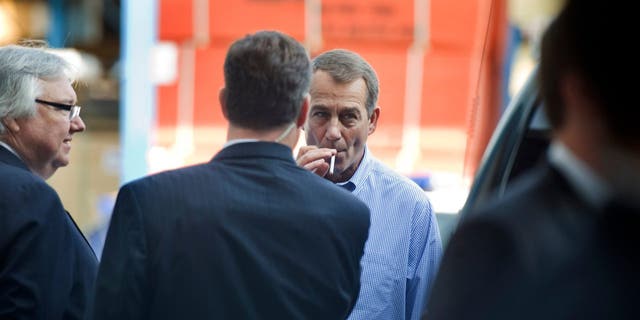 House Minority Leader John Boehner, R-Ohio, smokes a cigarette after a news conference outside of Tart Lumber Company in Sterling, Virginia, where they unveiled "A Pledge to America," a governing agenda devised by House Republicans for the 111th Congress. 